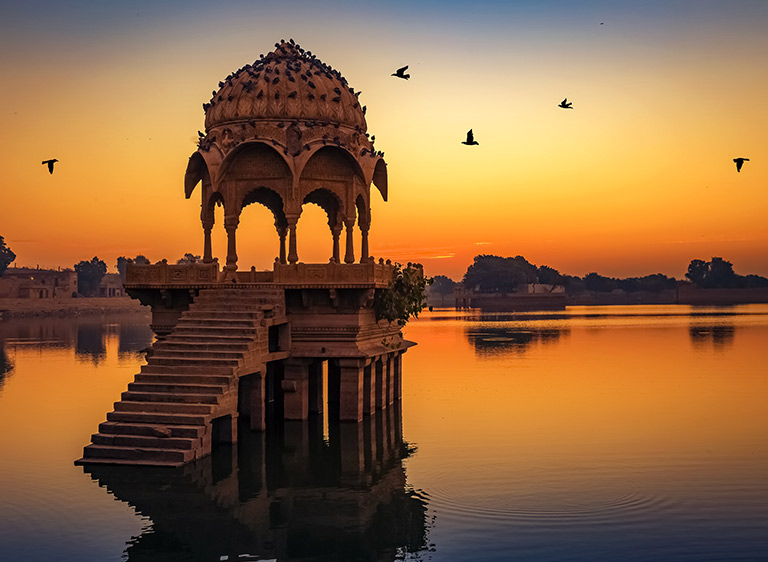 Gadisar Lake At Jaisalmer Rajasthan With Ancient Temple Architecture At Sunrise